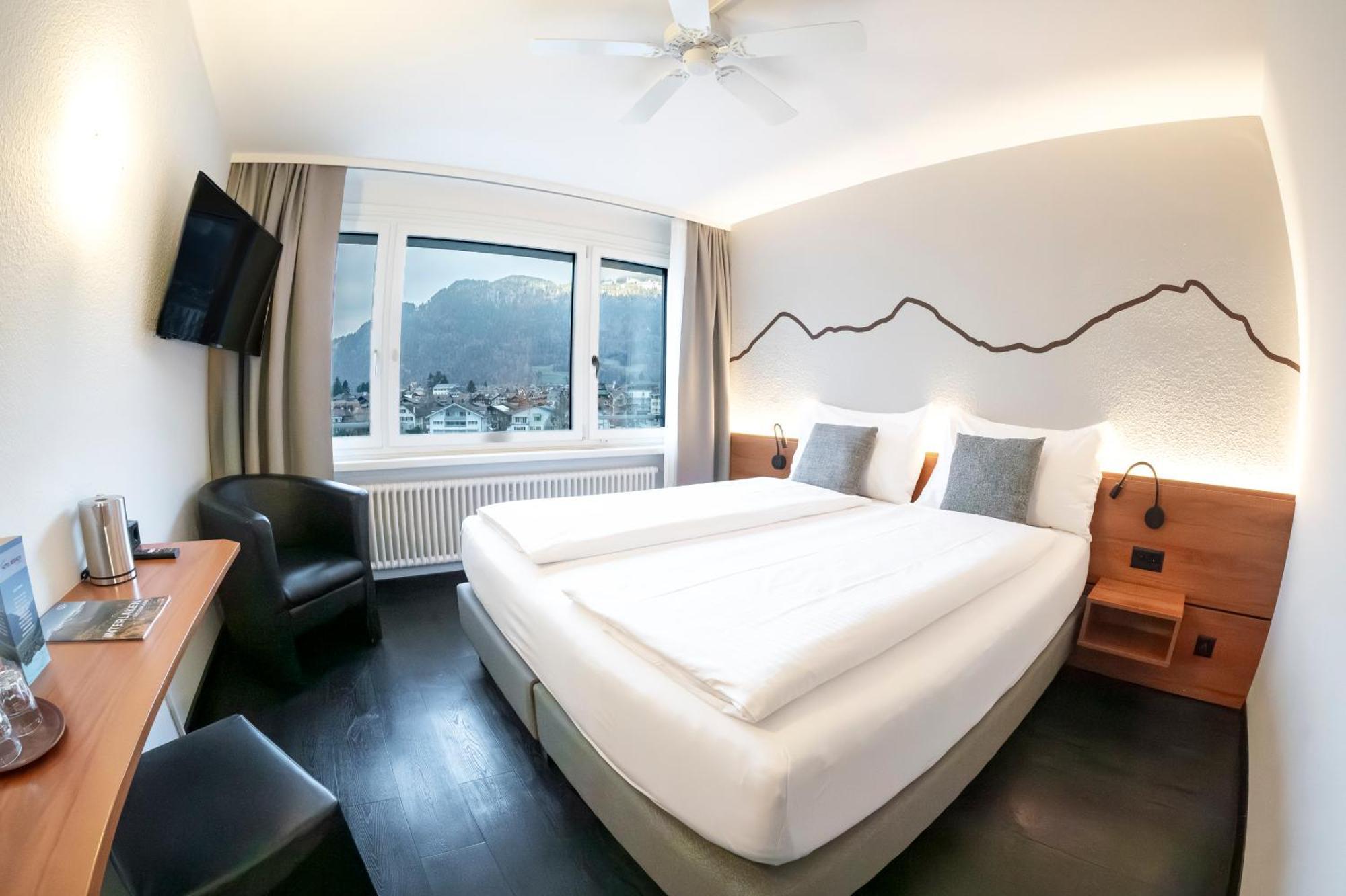Hotel Merkur - West Station Lodge Interlaken Bagian luar foto