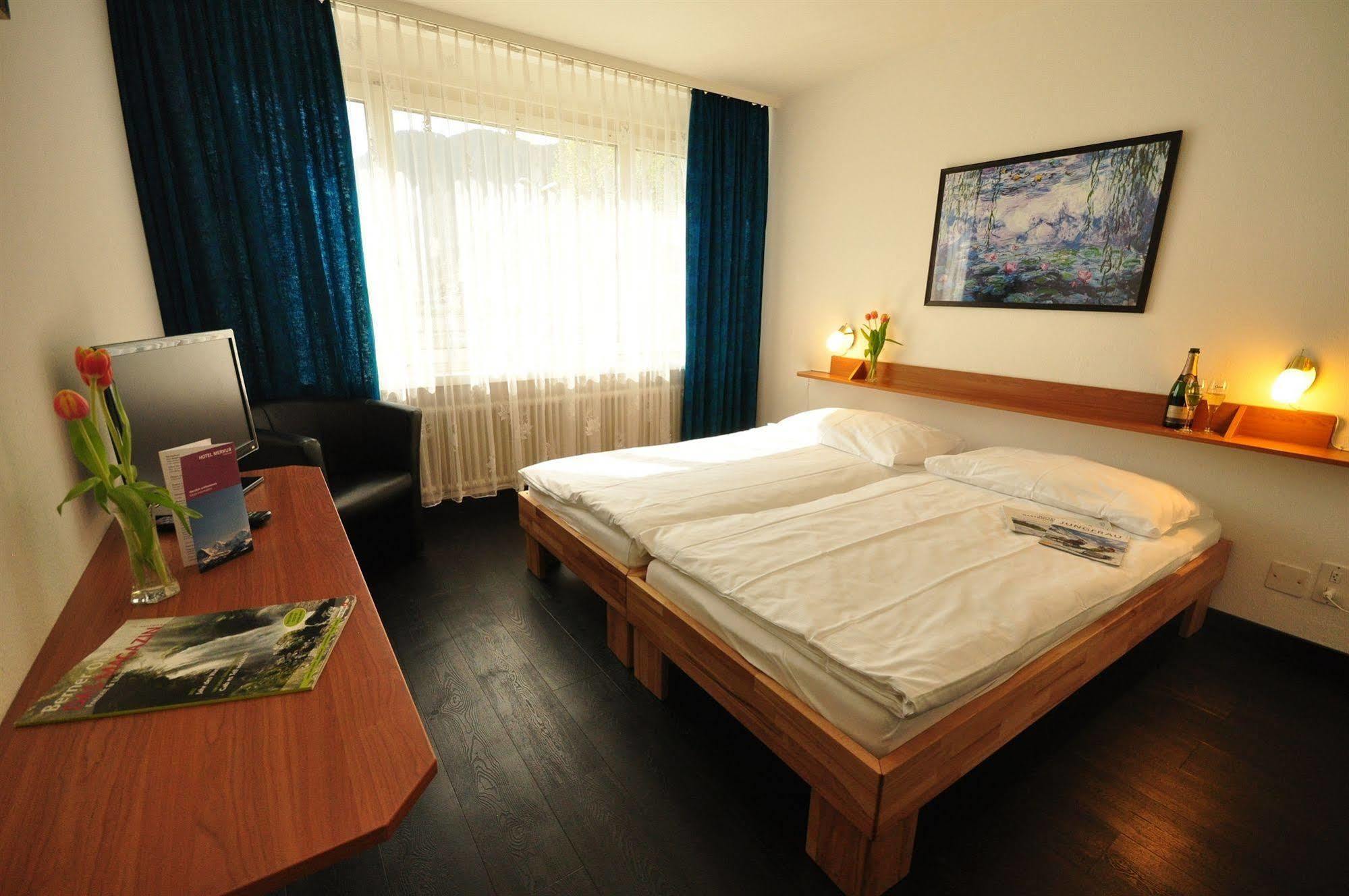 Hotel Merkur - West Station Lodge Interlaken Bagian luar foto